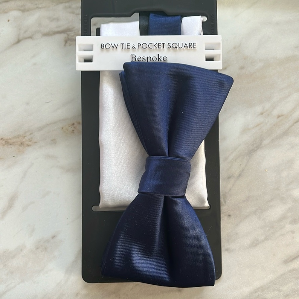 Men’s navy bow tie with white satin pocket square.